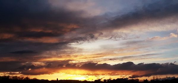 Low angle view of dramatic sky during sunset