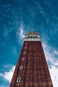 Low angle view of clock tower against sky