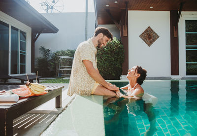 Couple kissing in swimming pool