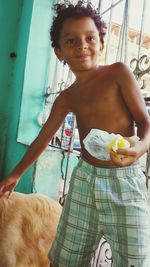 Portrait of smiling girl standing outdoors