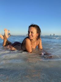 A woman enjoys time on the beach