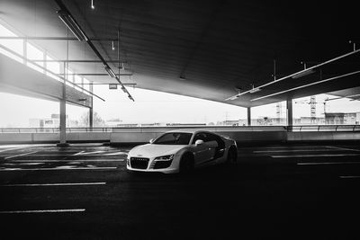 Car on bridge against sky