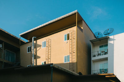 Low angle view of building against blue sky