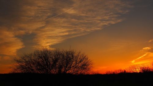 Silhouette of landscape against dramatic sky