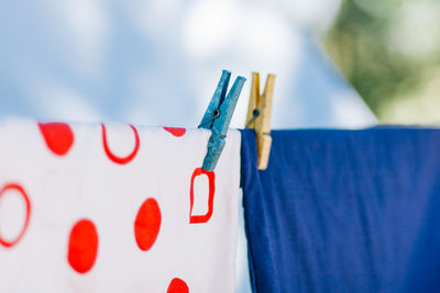 Close-up of clothes hanging on clothesline