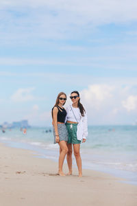 Full length of woman standing at beach