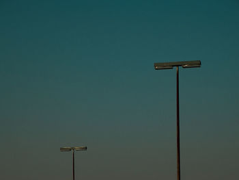 Low angle view of street light against sky