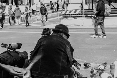 People standing on street in city
