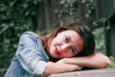 Portrait of smiling woman lying down