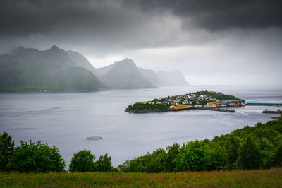 Scenic view of lake and mountains against sky