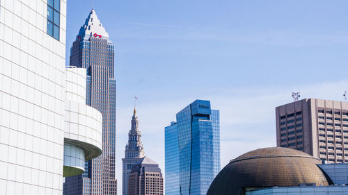 Low angle view of buildings against blue sky