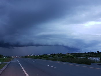 View of road against cloudy sky