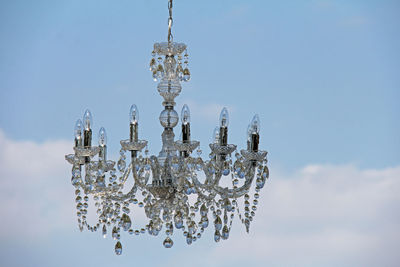 Close-up of chandelier against sky