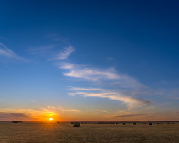 Scenic view of sunset over land