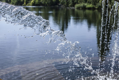 Close-up of water splashing in lake