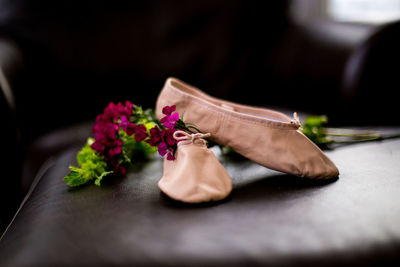 Close-up of pink rose on table