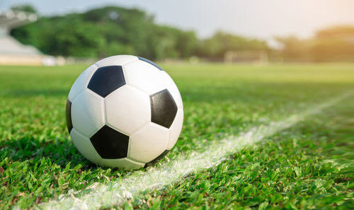 Close-up of soccer ball on field