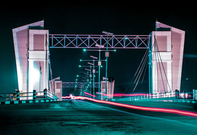 Light trails on bridge at night