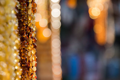 Close-up of illuminated lighting equipment at market stall