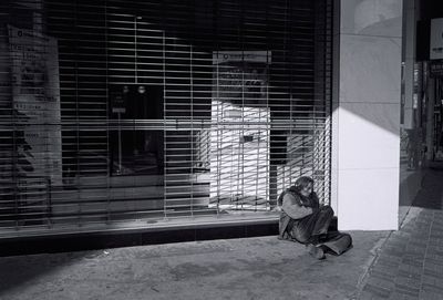 Woman standing in front of building