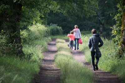 Teenager walking away from his mother and sister