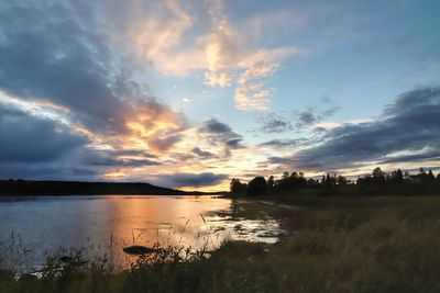 Scenic view of lake against sky during sunset