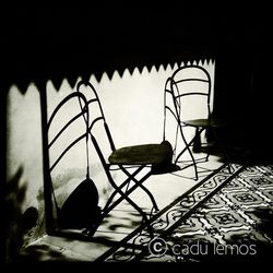 Empty chairs against wall