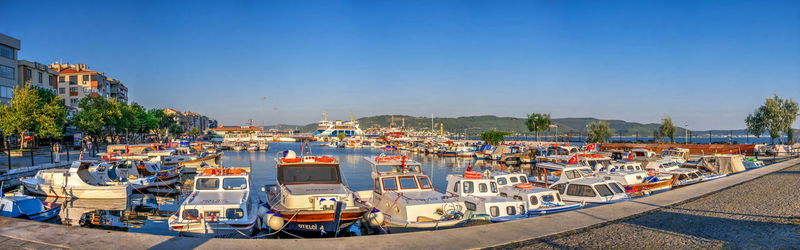 Panoramic view of city against clear blue sky