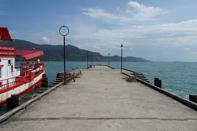 Pier over sea against sky