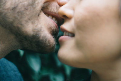 Cropped image of man and woman embracing