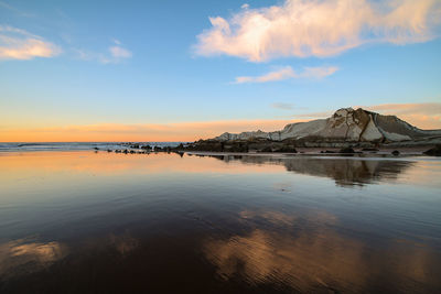 Scenic view of sea against sky at sunset