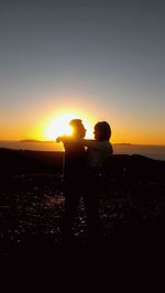 Silhouette of man and woman