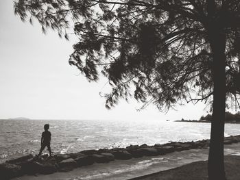 Man looking at sea against sky