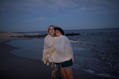 Friends hanging out on a beach