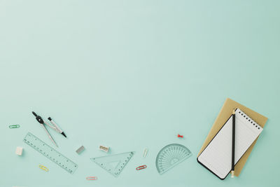 High angle view of papers over white background