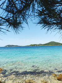 Scenic view of sea against clear blue sky