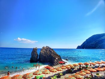 Scenic view of sea against blue sky