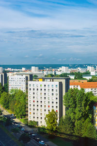 High angle view of buildings and sea against sky