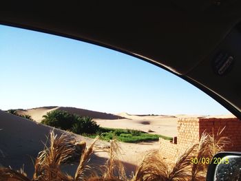 Panoramic view of desert against clear sky