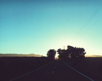 Country road against clear sky