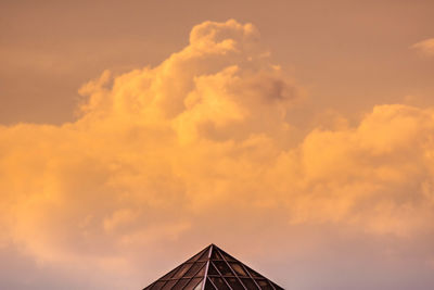 High section of building against orange sky