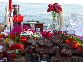 Red wine on table at beach