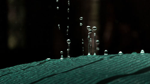 Close-up of water drops on metal