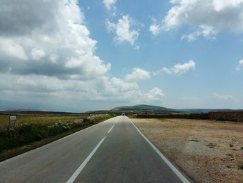 Empty road along landscape