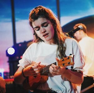 Young woman playing guitar