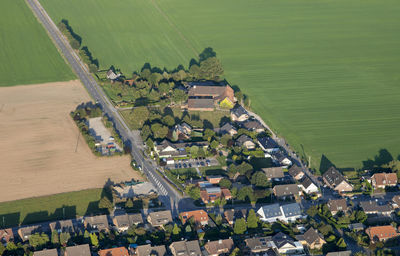 Aerial view of houses by landscape