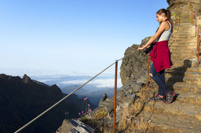 Young woman standing on mountain