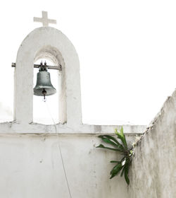 Low angle view of white bell outside building