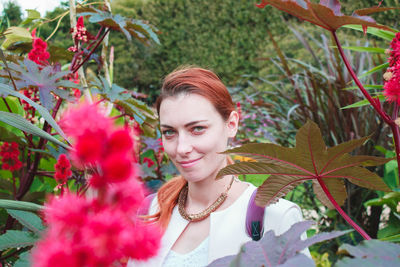 Portrait of young woman with flowers