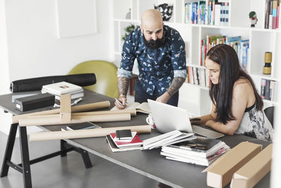 Architects using laptop at home office